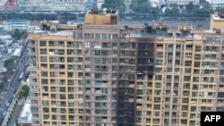 Aerial view of the fire at a residential building in Nanjing city, Jiangsu province, China, on Feb. 23, 2024. 