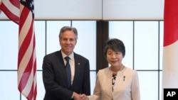 U.S. Secretary of State Antony Blinken, left, and Japanese Foreign Minister Yoko Kamikawa shake hands before their bilateral meeting at the Foreign Ministry's Iikura guesthouse in Tokyo, July 28, 2024.