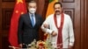 资料照片: 2022年1月9日中国外交部长王毅(左)在斯里兰卡科伦坡会见时任斯里兰卡总理马欣达·拉贾帕克萨