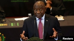 FILE - South African President Cyril Ramaphosa responds to a parliamentary debate on his state of the nation address in Cape Town, South Africa, Feb. 16, 2023.