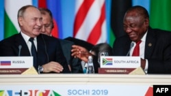 FILE - South-Africa's President Cyril Ramaphosa and Russia's President Vladimir Putin attend a meeting at the 2019 Russia-Africa Summit in Sochi, Russia, Oct. 24, 2019. (Photo by Sergei Chirikov/Pool/AFP)