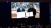 资料照片：媒体在韩国首尔通过大屏幕观看韩国前总统文在寅在平壤与朝鲜领导人金正恩签署协议。(2018年9月19日）