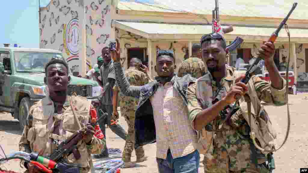 This picture taken on April 16, 2023, shows Sudanese army soldiers, loyal to army chief Abdel Fattah al-Burhan, posing for a picture at the Rapid Support Forces (RSF) base in the Red Sea city of Port Sudan. (AFP) &nbsp;