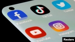 FILE - Facebook, TikTok, Twitter, YouTube and Instagram apps are seen on a smartphone in this illustration from July 13, 2021.