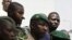 Lieutenant Amadou Konare, center, spokesman for coup leader Amadou Haya Sanogo, arrives to address supporters, in Bamako, Mali, March 28, 2012.