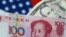 FILE - U.S. Dollar and China Yuan notes are seen in this picture illustration, June 2, 2017.