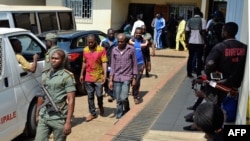 Men arrested in connection with Cameroon's anglophone crisis are seen at the military court in Yaounde, Cameroon, on December 14, 2018.