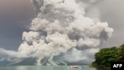 An eruption from Mount Ruang volcano is seen from Tagulandang island in Sitaro, North Sulawesi, on April 30, 2024. 