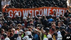 Акция протеста перед началом встречи лидеров стран «Большой двадцатки». Гамбург, Германия