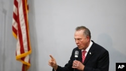 A man addresses protesters who have gathered near Yangon City Hall in Yangon, Myanmar, to protest against the military coup.