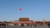 FILE - A Chinese flag flutters against blue sky in Tiananmen Square in Beijing, China, Dec. 24, 2017. 