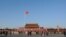 FILE - A Chinese flag flutters against blue sky in Tiananmen Square in Beijing, China, Dec. 24, 2017. 