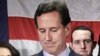 Surrounded by members of his family Republican presidential candidate, former Pennsylvania Sen. Rick Santorum announces he is suspending his candidacy effective today in Gettysburg, Pennsylvania, April 10, 2012.
