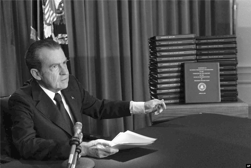 President Richard M. Nixon is shown pointing to the transcripts of the White House tapes in this April 29, 1974, file photo, after he announced during a nationally-televised speech that he would turn over the transcripts to House impeachment investigators