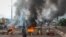 FILE - Anti-government protesters burn tires and barricade roads in the capital Bamako, Mali, July 10, 2020.