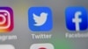 资料照：推特和脸书标志