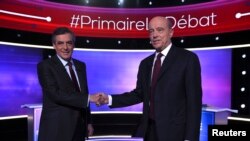 Alain Juppe (Dama) Francois Fillon (Hagu) a loakcin da suka halarci muhawara