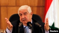 2013年8月27日叙利亚外长瓦利德•阿尔-穆阿利姆在大马士革举行的记者会上发表讲话。