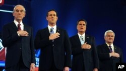 U.S. Republican presidential candidates (L to R) U.S. Rep. Ron Paul, former U.S. Senator Rick Santorum, former Massachusetts Governor Mitt Romney and former Speaker of the House Newt Gingrich stand for the National Anthem before the start of the Republica