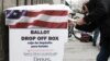 A voter participates in early balloting outside the Denver Elections Division in downtown Denver, Colorado on October 25, 2012. 