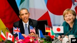 美國總統奧巴馬與德國總理默克爾(資料圖片)