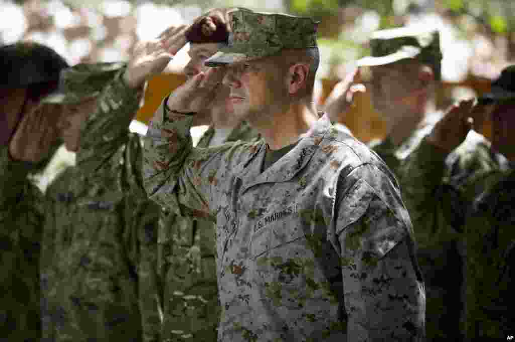 General John Allen, the top U.S. commander in Afghanistan, salutes before he observes Memorial Day at ISAF headquarters in Kabul, Afghanistan, May 28, 2012.