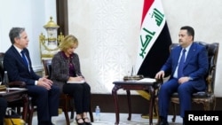 伊拉克總理穆罕默德·希亞·蘇達尼(右)在巴格達會晤美國國務卿布林肯(左)。