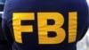 FILE PHOTO: An FBI logo is pictured on an agent's shirt in the Manhattan borough of New York City