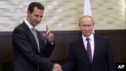 Shugaban Syria, Bashar al Assad (Dama) da takwaran aikinsa na Rasha, Vladimir Putin (Dama)
