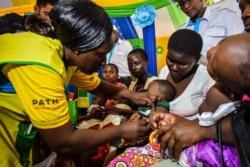 A health worker vaccinates a child against malaria in Ndhiwa, Homabay County, western Kenya, Sept. 13, 2019, during the launch of a malaria vaccination campaign in the country.