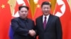 North Korean leader Kim Jong Un and Chinese President Xi Jinping shake hands at the Great Hall of the People in Beijing, China, in this picture released to Reuters on March 28, 2018.