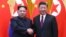 North Korean leader Kim Jong Un and Chinese President Xi Jinping shake hands at the Great Hall of the People in Beijing, China, in this picture released to Reuters on March 28, 2018.