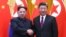 North Korean leader Kim Jong Un and Chinese President Xi Jinping shake hands at the Great Hall of the People in Beijing, China, in this picture released to Reuters on March 28, 2018.