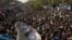 Supporters of cleric Tahir-ul Qadri listen to his speech at an anti-government rally in Islamabad, Pakistan, January 15, 2013.