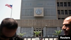 U.S. President Barack Obama, third from left, and British Prime Minister David Cameron, fourth from left, listen to NATO Secretary General Anders Fogh Rasmussen, third from right, as they participate in NATO Summit Session One, on Afghanistan and the Isla