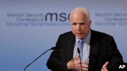 A member of the artistic group Cirk La Putyka performs on a trampoline to entertain residents as the movement remains restricted to stem the spread of the novel coronavirus in Prague, Czech Republic.