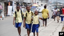 Facebook CEO and Harvard dropout Mark Zuckerberg, right, gestures as actor James Earl Jones, left, looks on while seated on stage during Harvard University commencement exercises, in Cambridge, Massachusetts. Zuckerberg was presented with an honorary Doctor of Laws degree and gave a commencement address.
