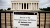 A sign warning that national parks are closed due to the government shutdown is posted in front of the Lincoln Memorial in Washington, Oct. 1, 2013. 