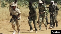 Members of a Malian pro-government militia operating in government-controlled areas take part in a training session at their base in Sevare, about 600 kilometers northeast of the capital Bamako, Mali, November 12, 2012.