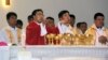 In this photo released by Henan Catholic, Rev. Joseph Zhang Yinlin, second left, takes part in an ordination ceremony to be named coadjutor bishop of Anyang, in Anyang city in central China's Henan province, Aug. 4, 2015.