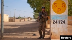A French soldier secures an area next to an abandoned jihadist bomb factory in Gao, Mali, February 13, 2013. 