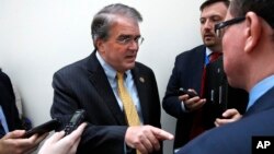FILE - Rep. John Culberson, R-Texas, left, speaks to reporters on Capitol Hill in Washington, Sept. 6, 2017. 