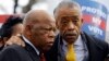 U.S. Rep. John Lewis (L) and the Rev. Al Sharpton confer during a voter's rights rally in front of the U.S. Supreme Court in Washington, Feb. 27, 2013. 