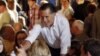  U.S. Republican presidential candidate Mitt Romney greets supporters after speaking at a pancake breakfast in Wauwatosa, Wisconsin, April 1, 2012. 