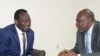 Dioncounda Traore (L), the new interim leader talks with Cheick Mohamed Abdoulaye Souad, aka Modibo Diarra, new prime minister, in Koulouba. Mali's former junta arrested two more politicians as the new interim prime minister weighs the make-up of a unity 