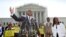 Ryan P. Haygood, director of the NAACP Legal Defense Fund, talks outside the Supreme Court in Washington, June 25, 2013, about the Shelby County v. Holder, a voting rights case in Alabama.