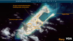 卫星照片所显示的十字火礁（永暑礁）上接近完成的机场。（资料照）