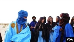 Moussa el Mouctar, an ethnic Tuareg from Timbuktu, with friends at a festival near Timbuktu, Mali, 2011-2012. Douglas Post (Park/Saharan Archaeological Research Association)