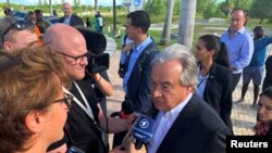 U.N. Secretary-General Antonio Guterres talks to the media outside an evacuation center in Nassau, Bahamas, Sept. 13, 2019. Guterres said he'd never seen such devastation.