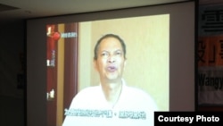 香港民间团体召开记者会播放李旺阳接受香港媒体采访的视频(潘嘉伟推特图片)